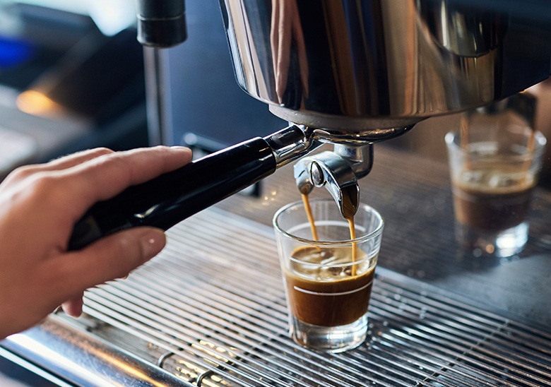 expresso pouring into a cup