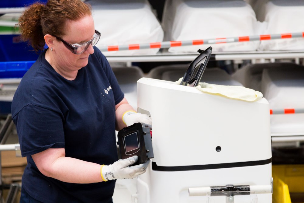 woman assembling a softener