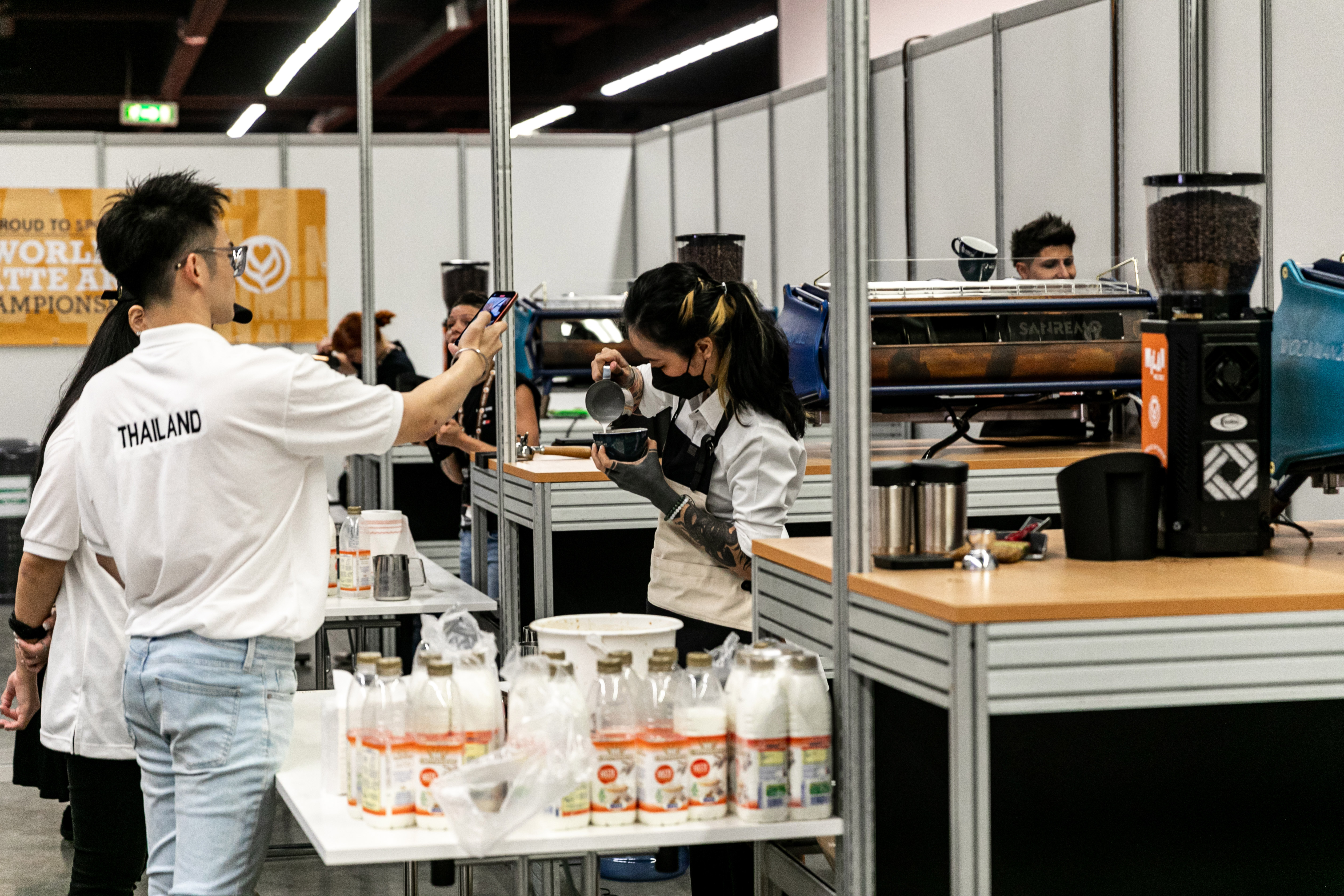 people making coffee on a trade show stand