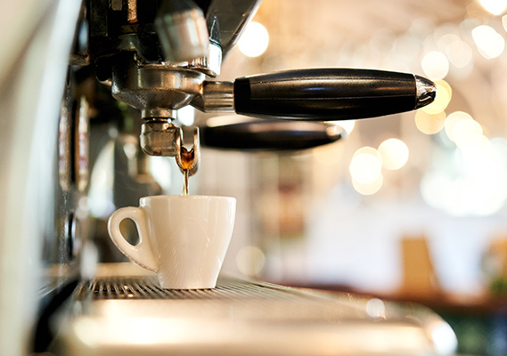 coffee dripping into a cup